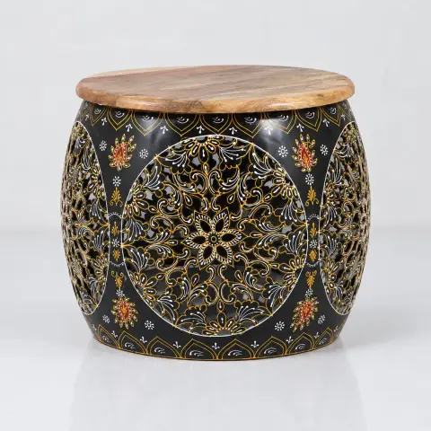 Three-quarter product view of the accent table showing its rounded mango wood top, curved black body and detailed gold, white and orange floral patterns.