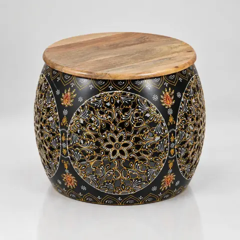 Three-quarter product view of the accent table showing its rounded mango wood top, curved black body and detailed gold, white and orange floral patterns.